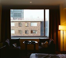 Dim room with a large window at dusk