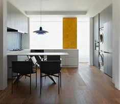 Minimal kitchen with a dining table and pendant lamp